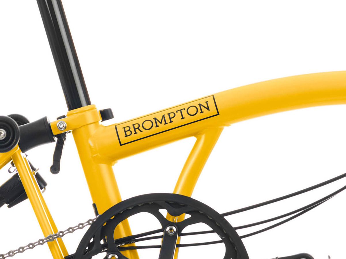 Brompton C Line Explore Bumblebee Yellow - 6 speed with Mid handlebar, with Front Carrier Block, with front/rear lights and roller frame
